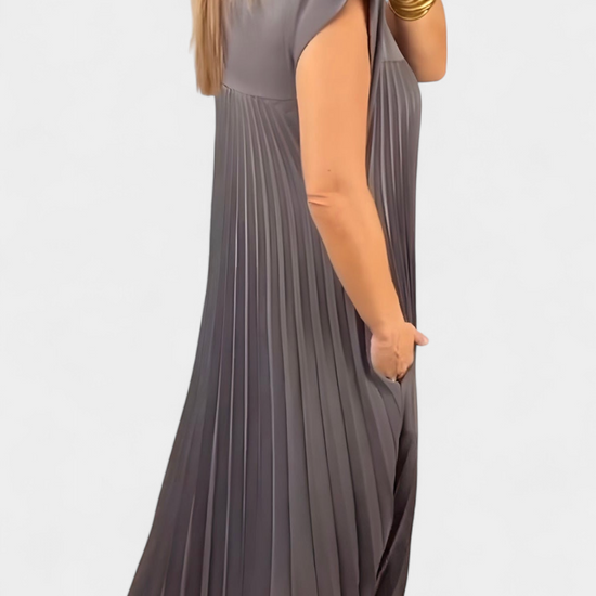 Manuela Mouwloze Jurk met Plooien en Hoge Taille